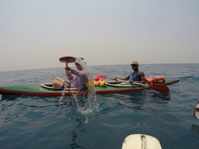 Double kayak with two males on the water