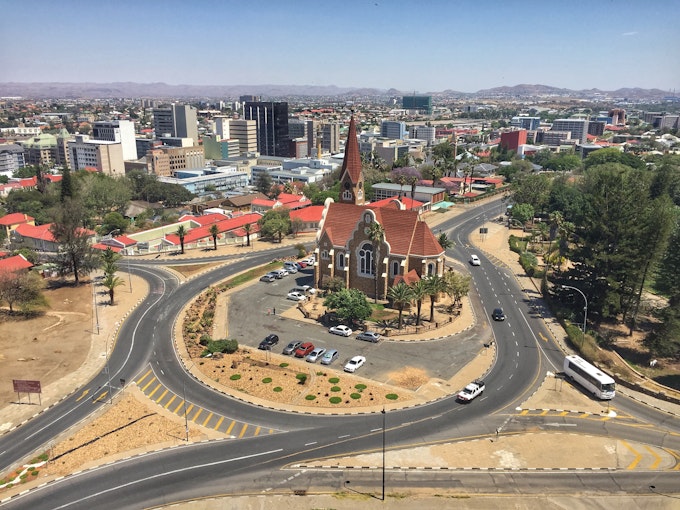 Overlooking a city with a large traffic circle encompassing a church
