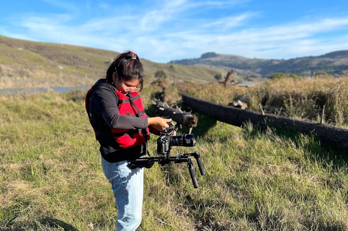 Lauren holds the camera while on location on Native California lands.