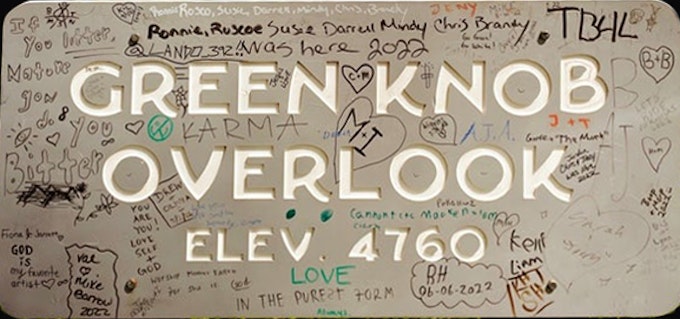 A park service sign reads, 