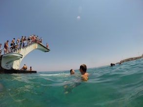 Jumping off the Diving Block off Elli Beach 