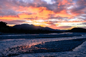 Watch the Sunset from the Waiho River Bridge