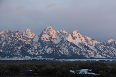 Watch the Sunrise Against the Grand Teton Mountains