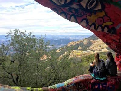 Explore the colorful Jim Morrison Cave and scramble over rocks in the hills of Malibu