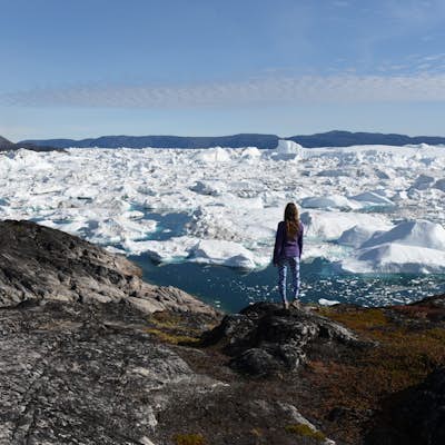 Hike the Ilulissat Icefjord by taking the Green Trail to Sermermiut then following the Blue Trail